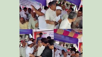 ত্রাণ বিতরণের সময় মঞ্চ ভেঙে পড়লেন অর্থমন্ত্রী